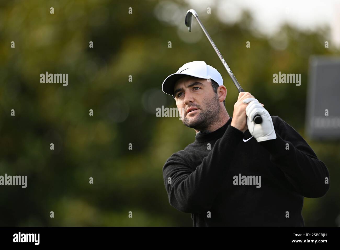 Scottie Scheffler hits from the first tee at Pebble Beach Golf Links