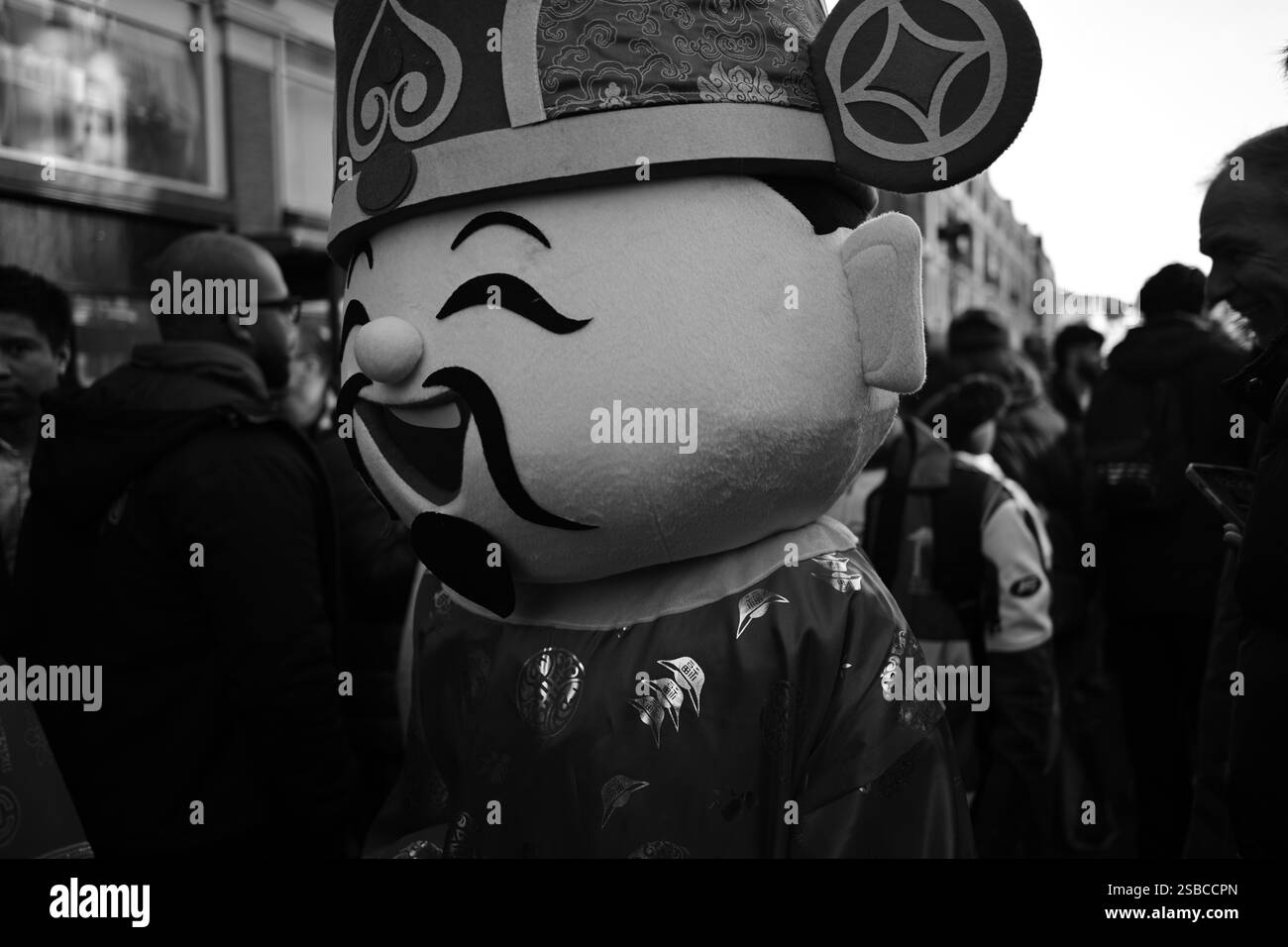 Lively Street Scene Featuring Mascot During the Chinese New Year Celebrations in London Stock Photo