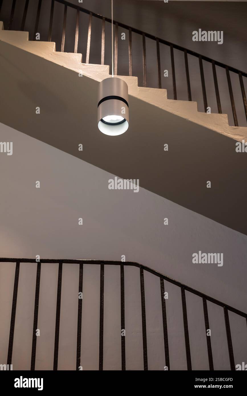 1930s interior with a staircase and a ceiling lamp Stock Photo - Alamy
