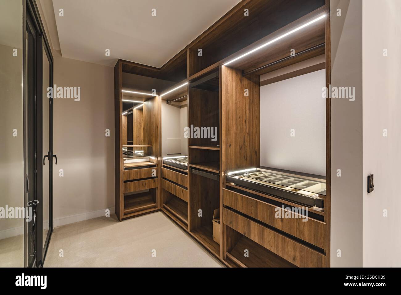 a close up image of a newly installed illuminated walk in wardrobe in luxury mediterranean real estate Stock Photo