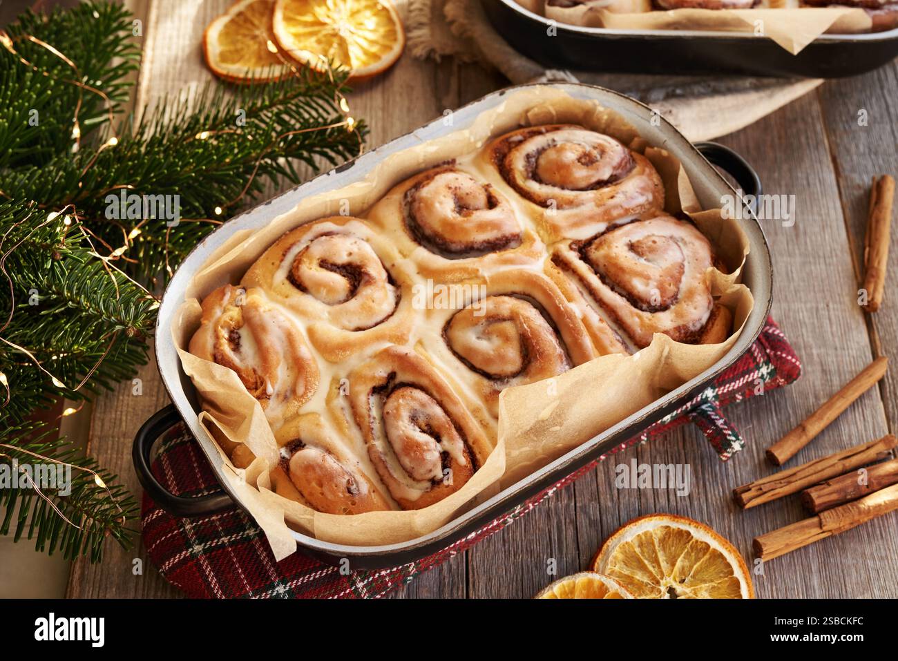 Homemade cinnamon rolls in a baking pan on a table Stock Photo