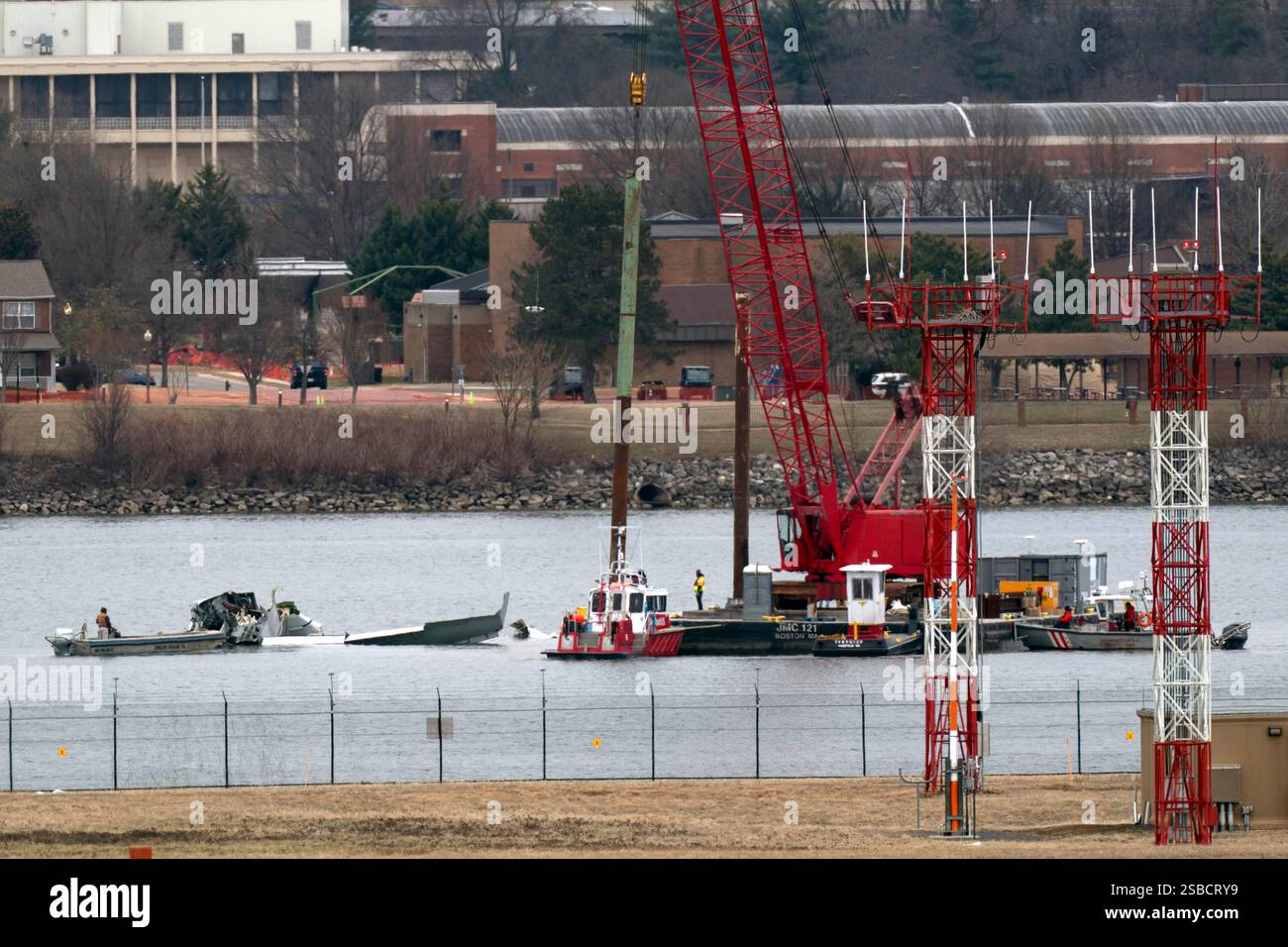 Rescue and salvage crews work near the wreckage of an American Airlines ...