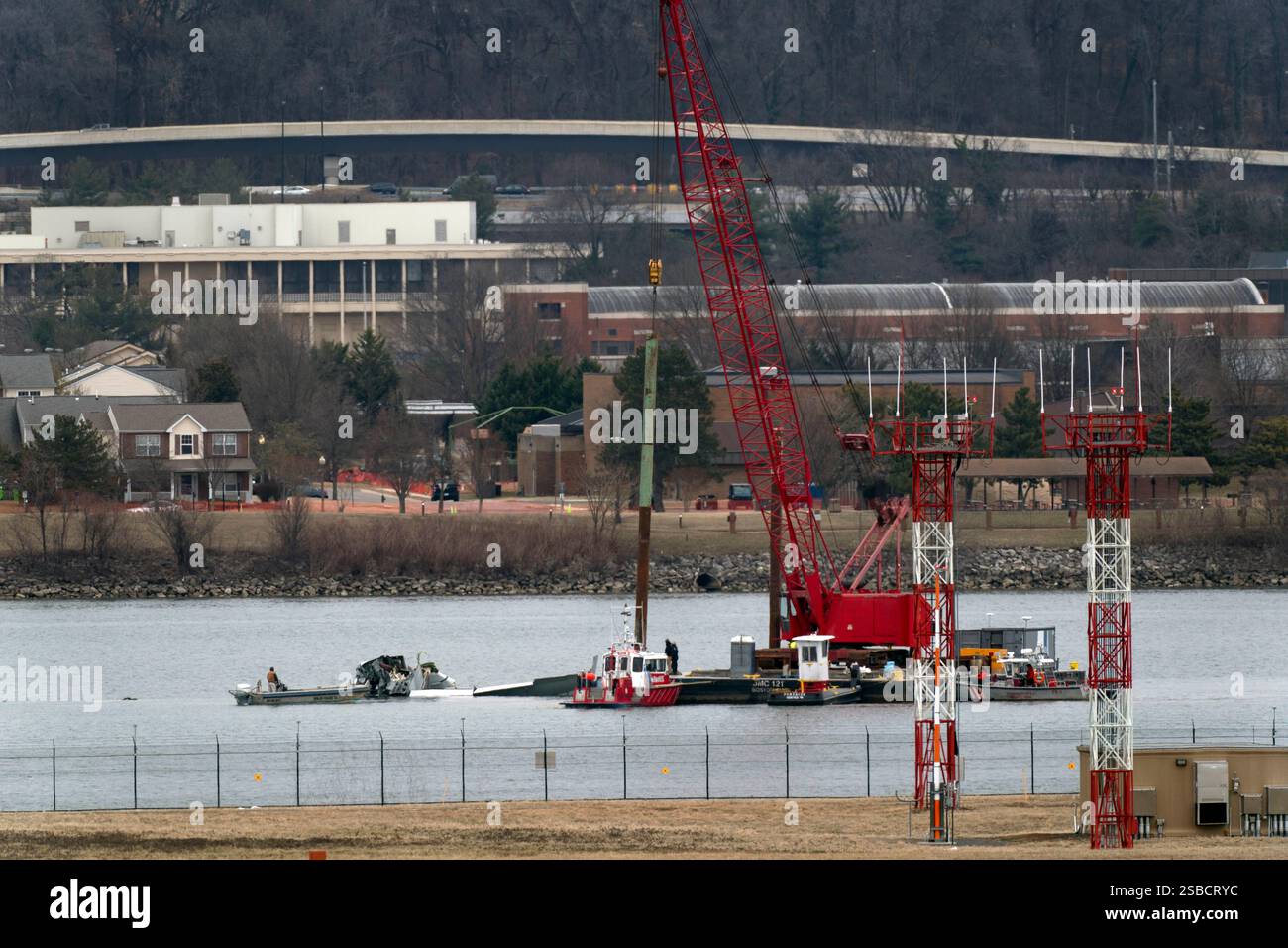 Rescue and salvage crews work near the wreckage of an American Airlines ...