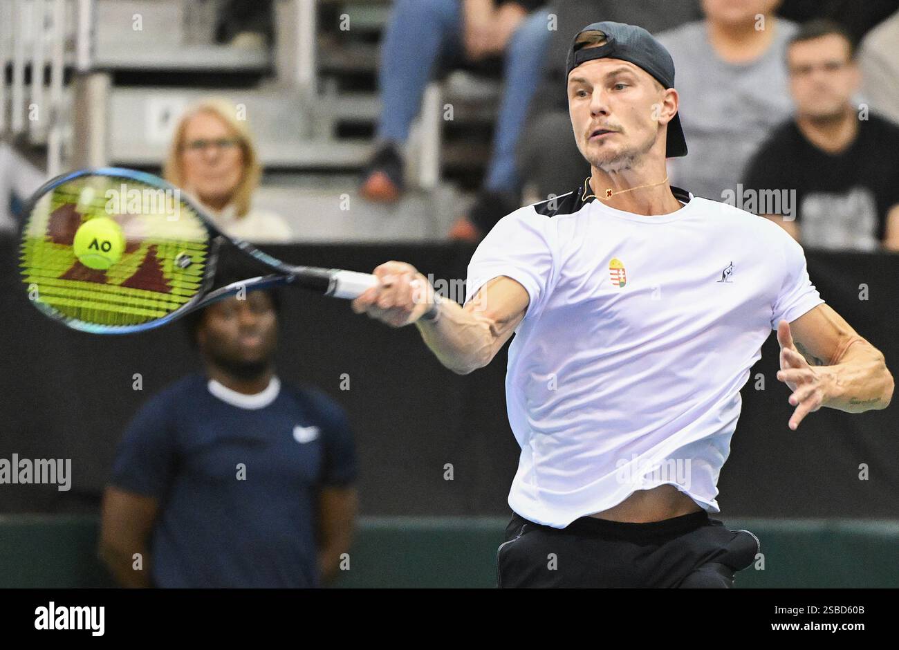 Marton Fucsovics, of Hungary, plays a shot to Alexis Galarneau, of