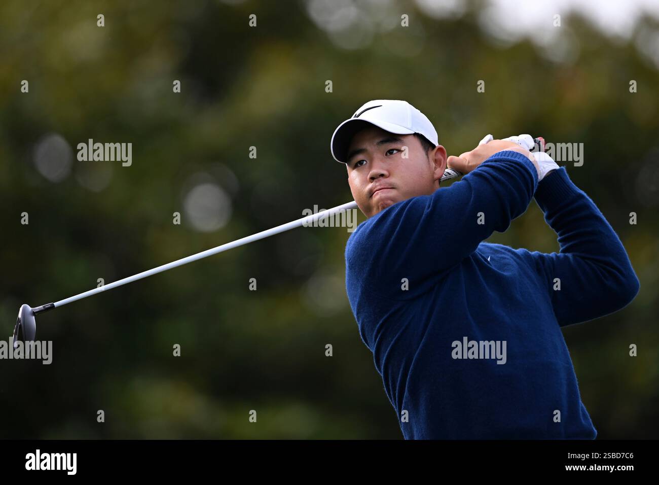 Tom Kim hits from the first tee at Pebble Beach Golf Links during the