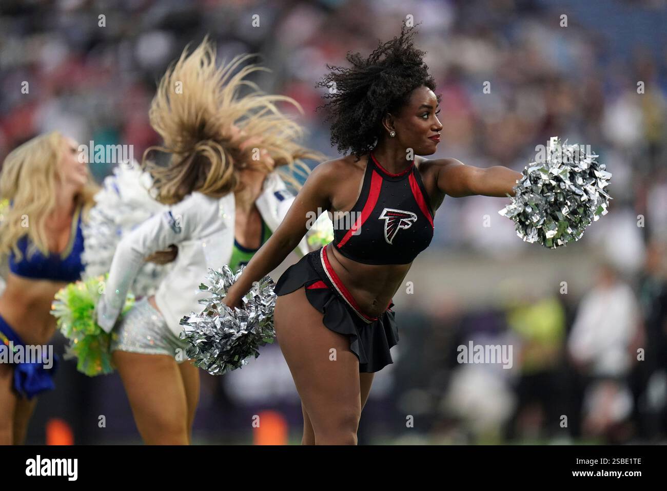An Atlanta Falcons cheerleader performs during the flag football event