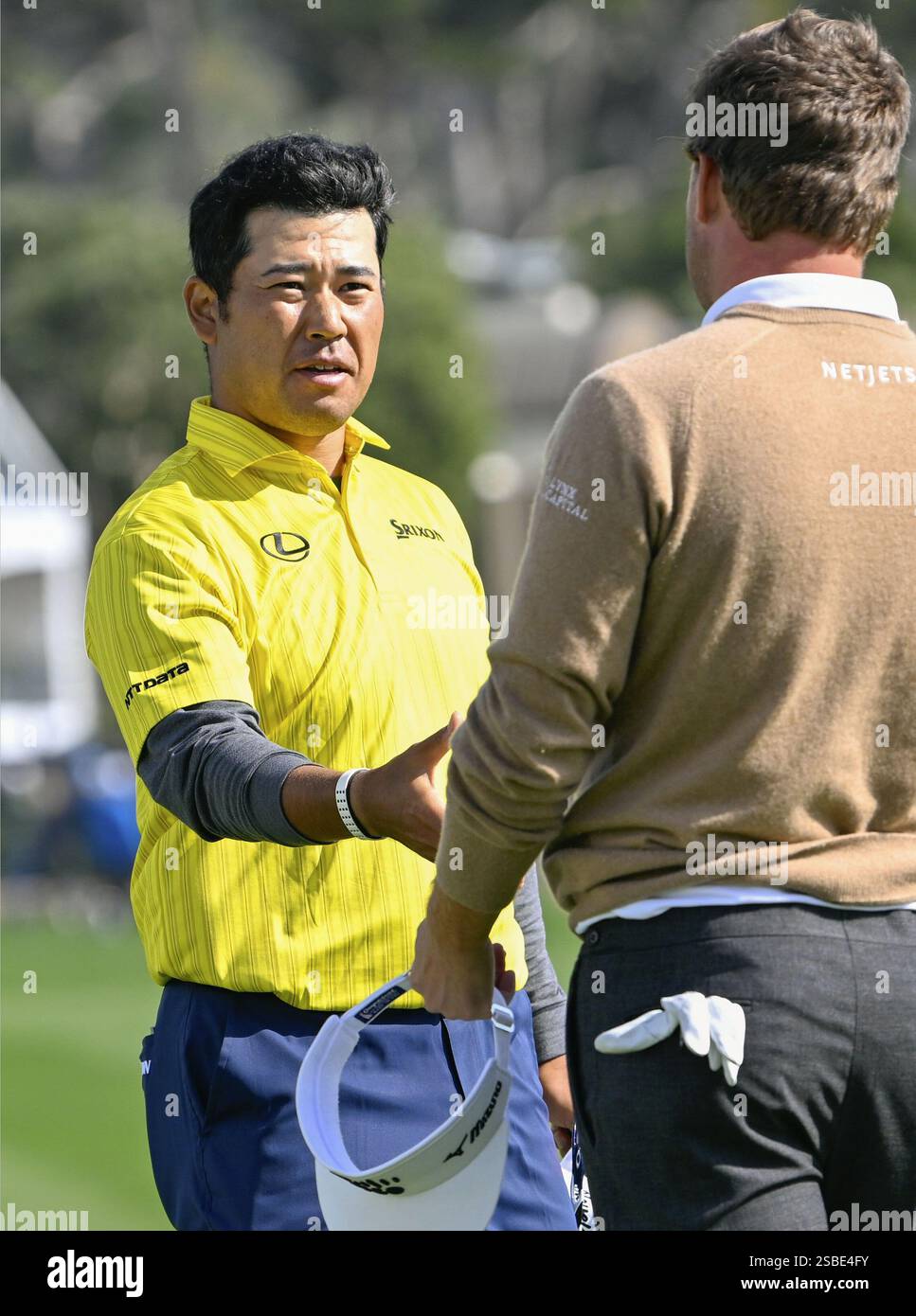 Hideki Matsuyama (L) of Japan is pictured after finishing the final