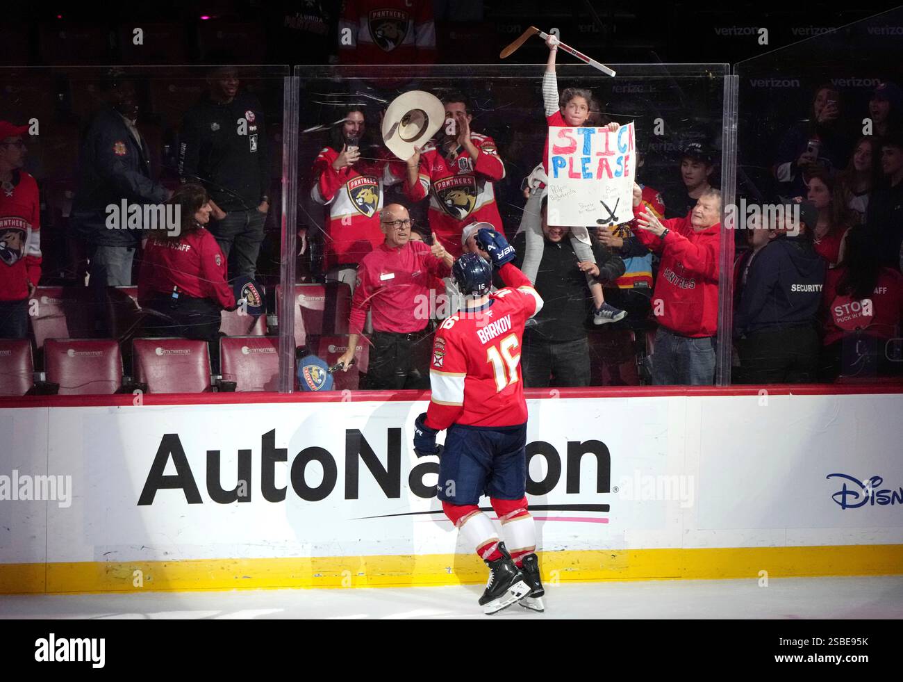 Florida Panthers center Aleksander Barkov (16) hands his stick to a fan