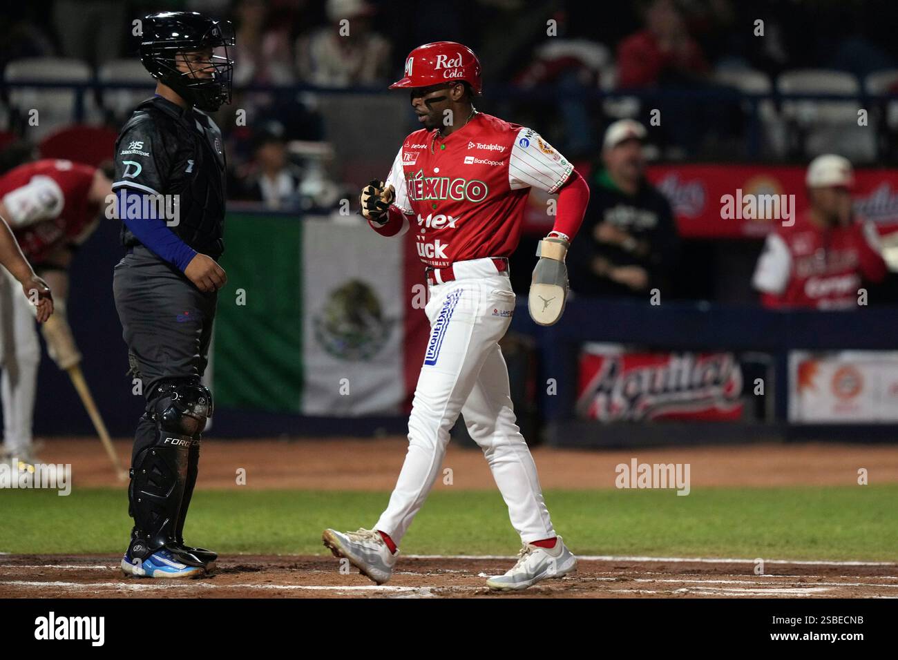 Mexico's Rudy Martin, right, scores a run against Dominican Republic
