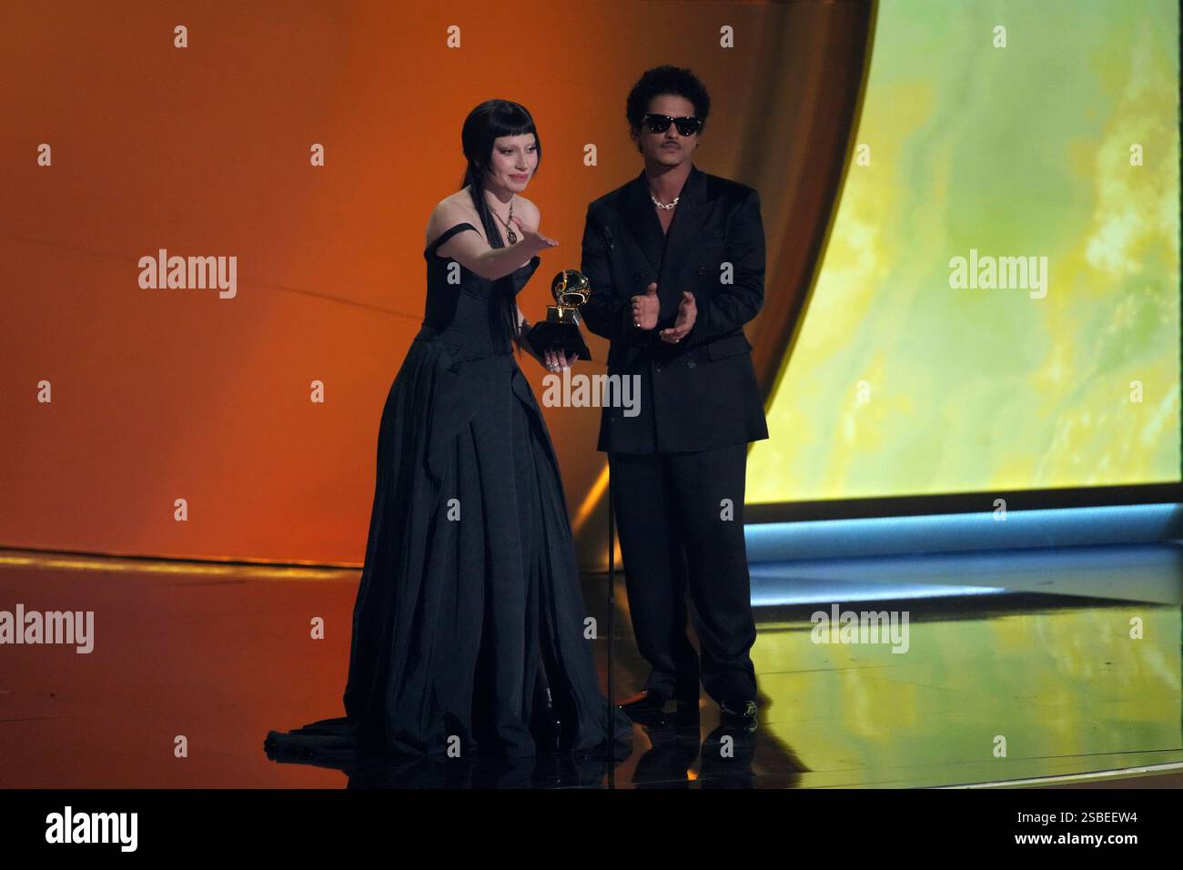Lady Gaga, left, and Bruno Mars accept the award for best pop duo/group