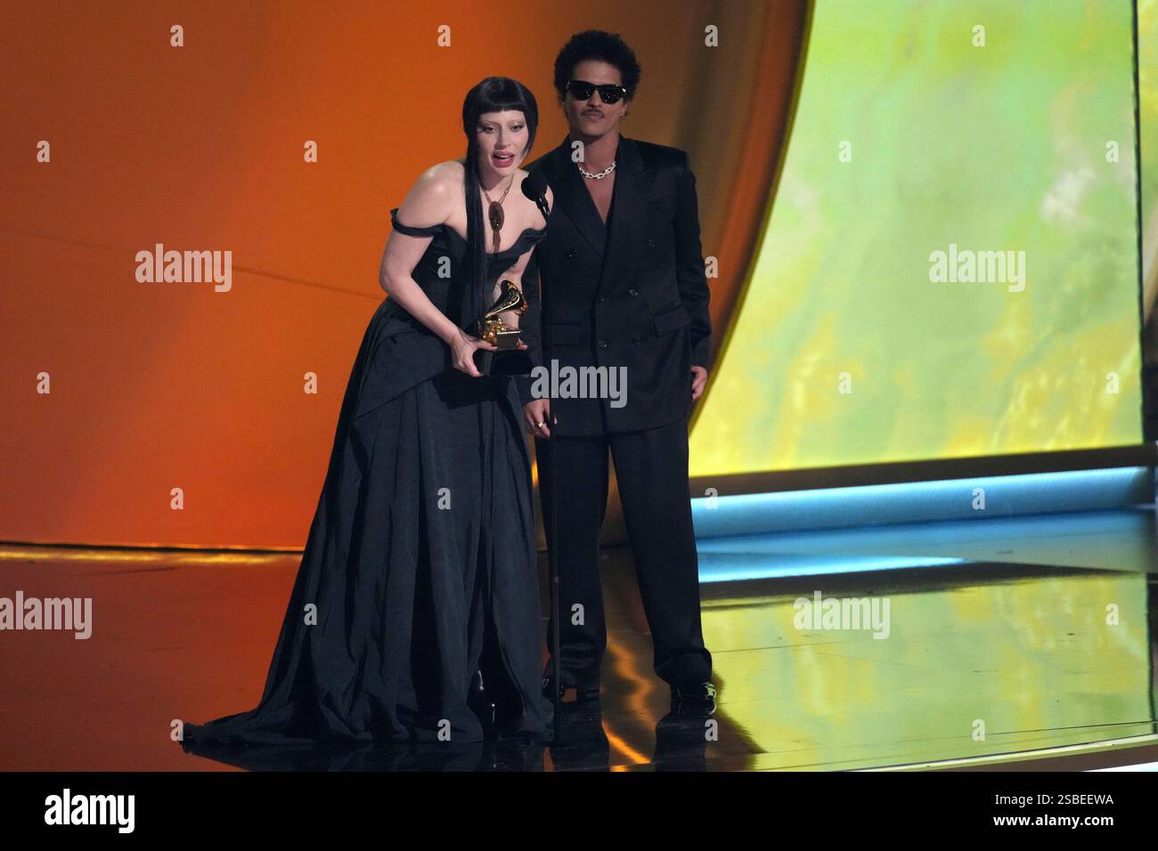 Lady Gaga, left, and Bruno Mars accept the award for best pop duo/group