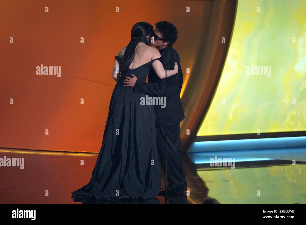 Lady Gaga, left, and Bruno Mars accept the award for best pop duo/group