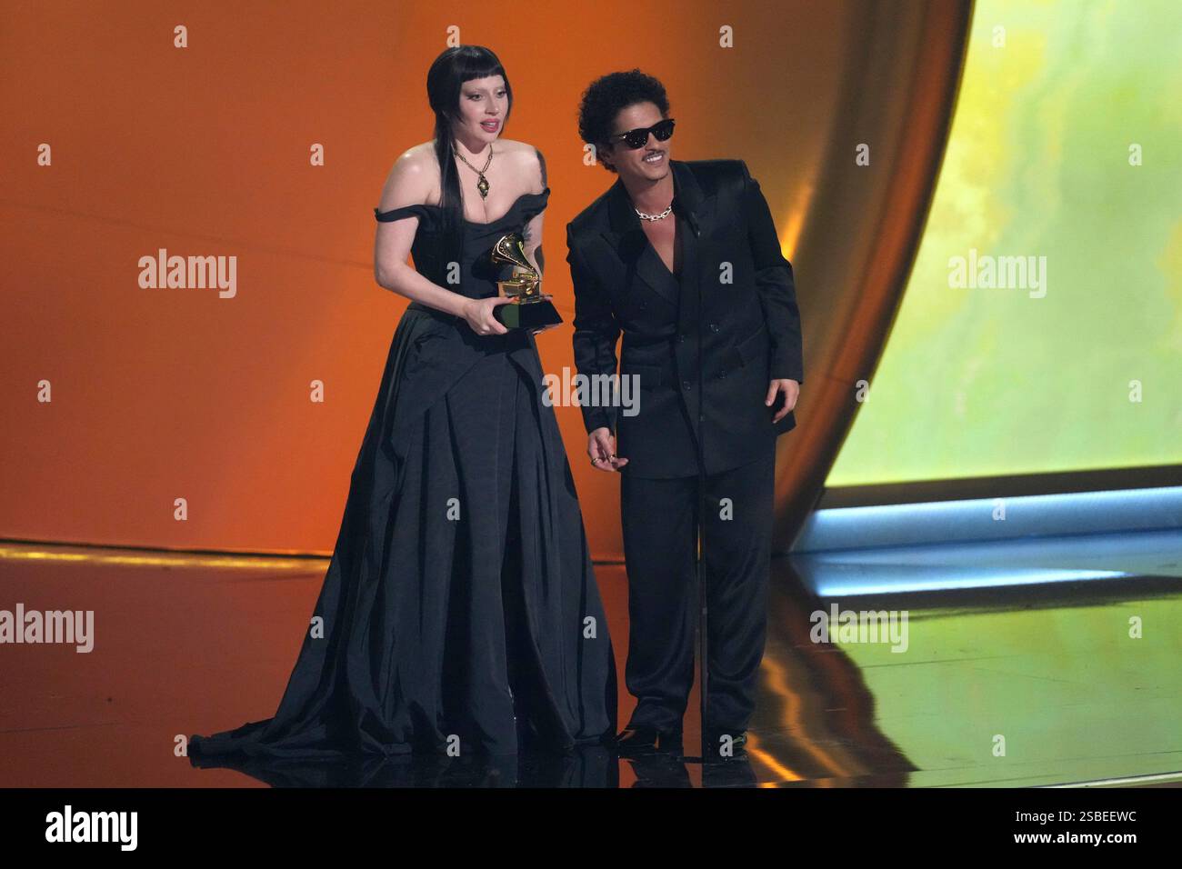 Lady Gaga, left, and Bruno Mars accept the award for best pop duo/group
