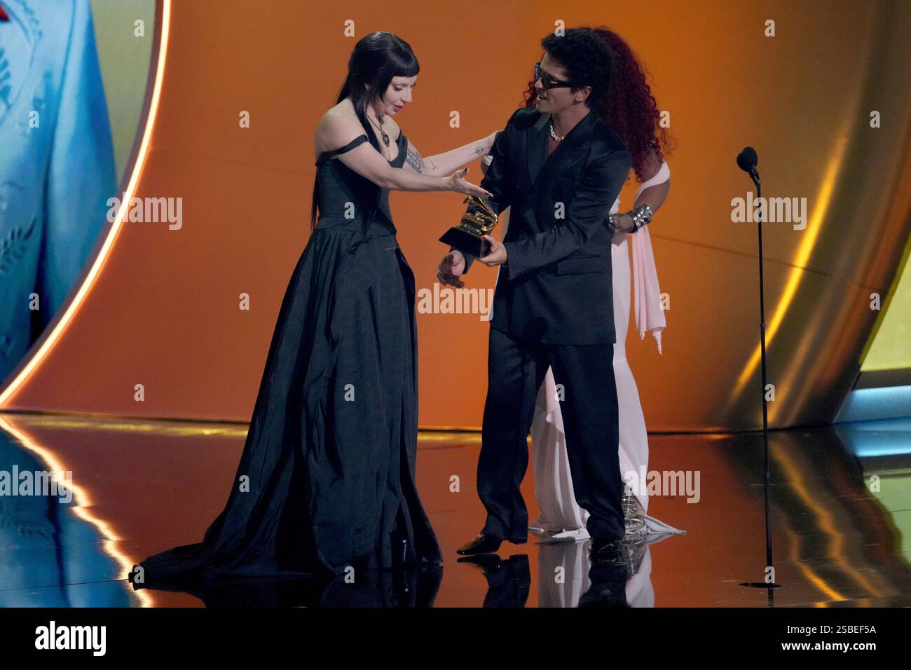 Lady Gaga, left, and Bruno Mars accept the award for best pop duo/group