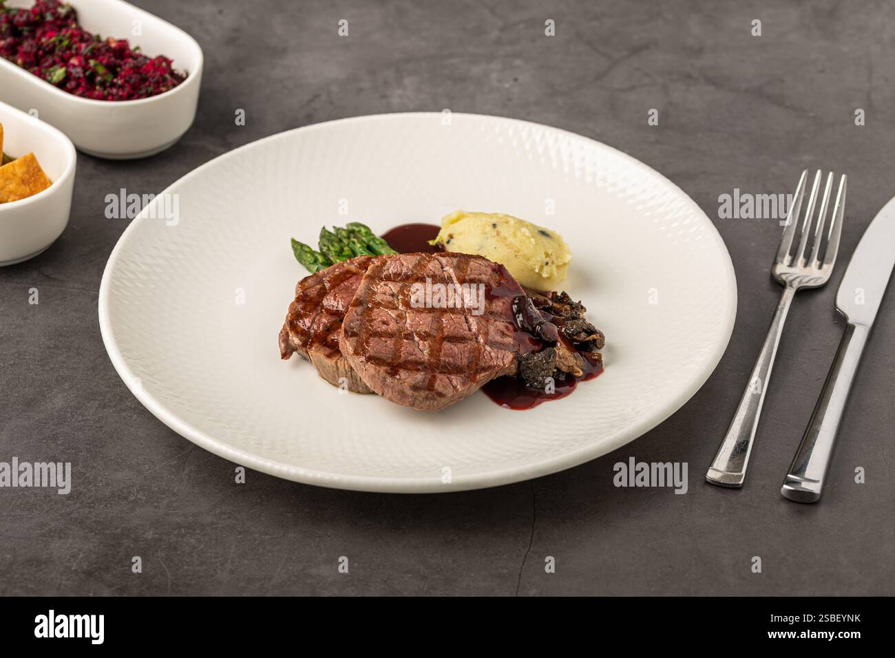 Grilled beef steak with red wine sauce, mashed potatoes, and asparagus ...