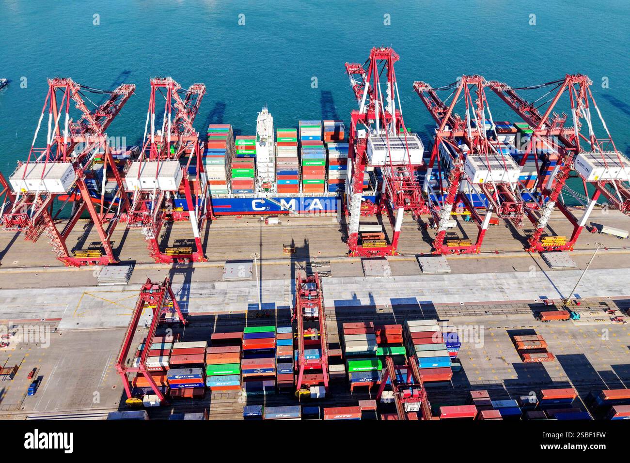QINGDAO, CHINA - FEBRUARY 3, 2025 - Cargo ships load and unload foreign ...