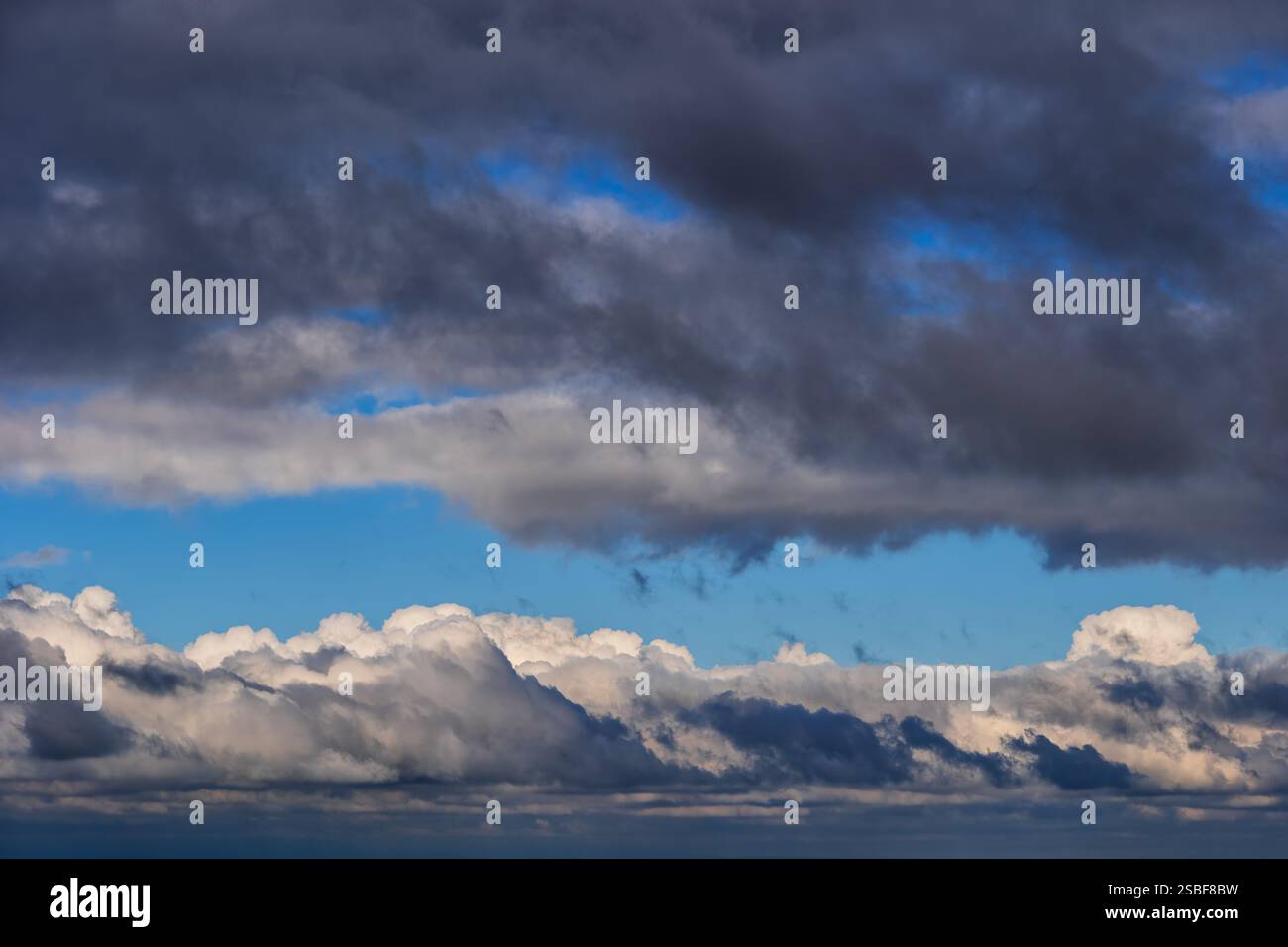 Dark and white clouds in the sky, cloudscape natural background. Stock Photo