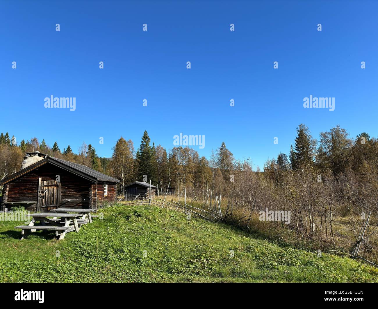 Golden autumn landscape of north Sweden and a vintage cabin.. Stock Photo