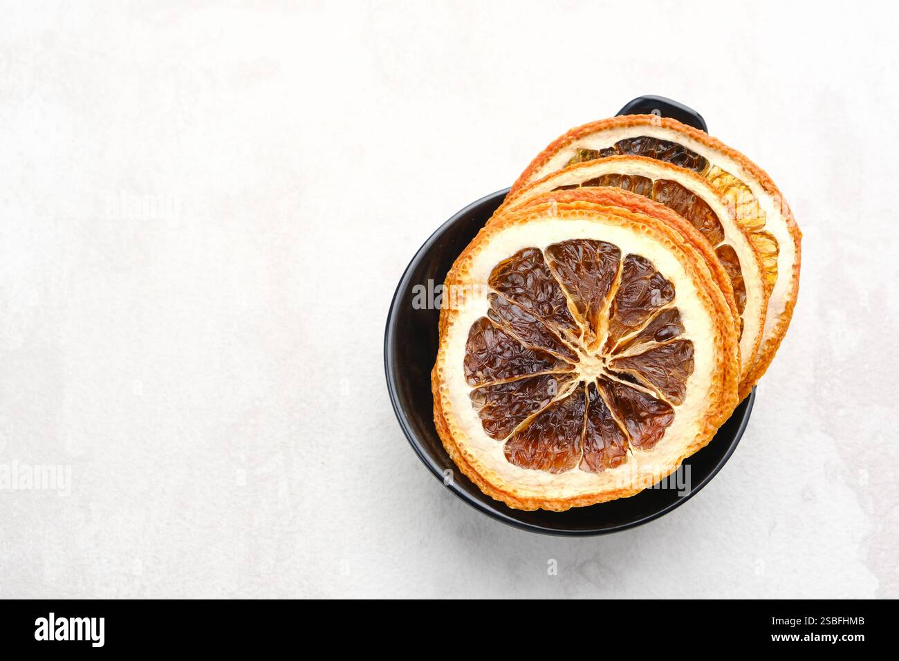Dried orange slices on white background Stock Photo