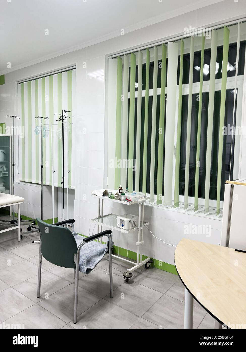 Bright and clean hospital room featuring medical equipment, a patient ...
