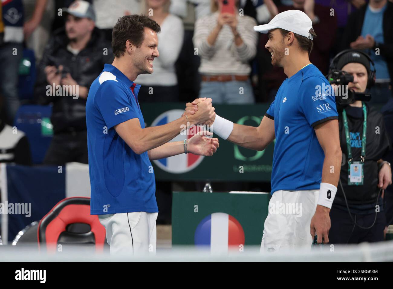 Davis Cup Captain of France PaulHenri Mathieu celebrates the doubles