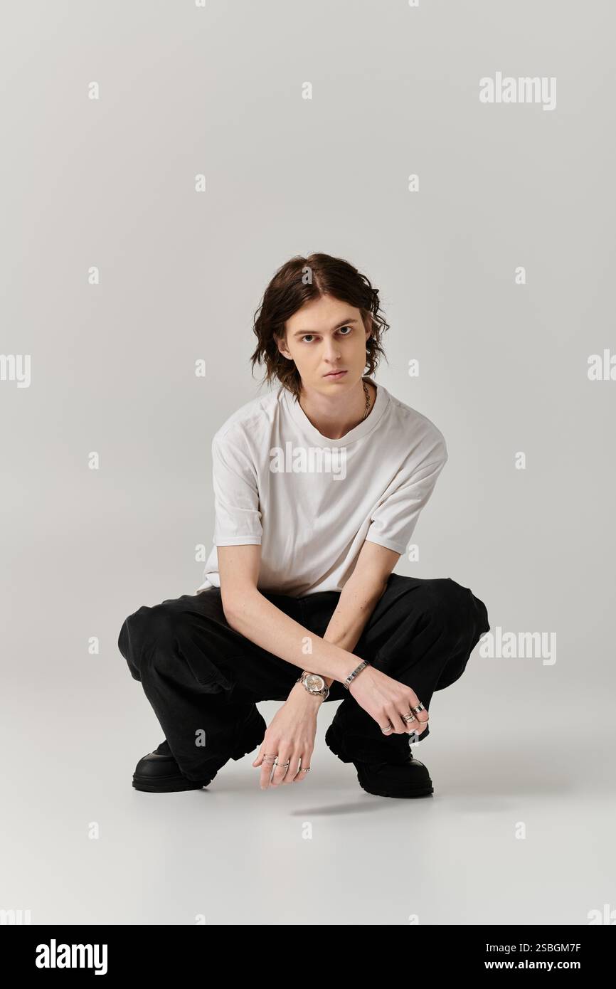 Handsome young man poses confidently in a trendy outfit amid a sleek ...