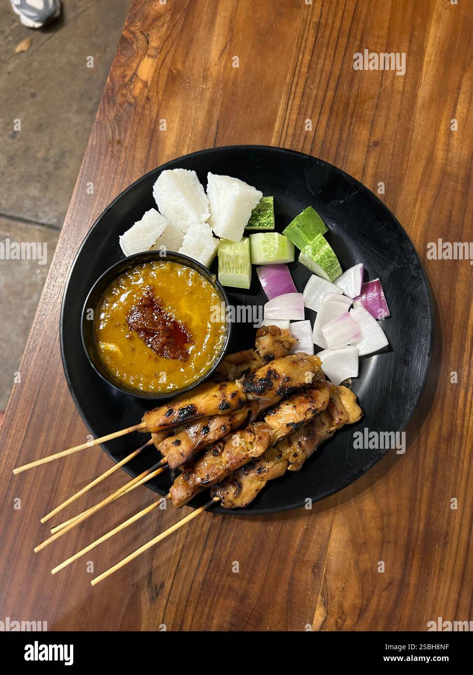 Dinner of Satay and peanut sauce at Limapulo restaurant in Kuala Lumpur, Malaysia Stock Photo