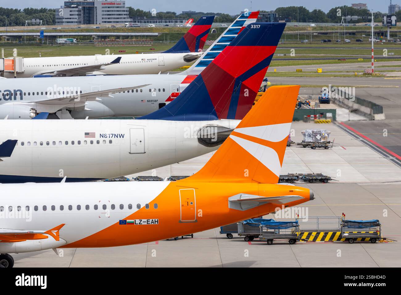 Amsterdam, Netherlands - July 1, 2024: Airplane tails at Amsterdam Airport in the Netherlands. Stock Photo