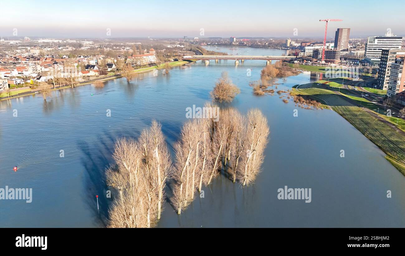 Aerial drone view of high water in Maas river and Venlo town cityscape ...