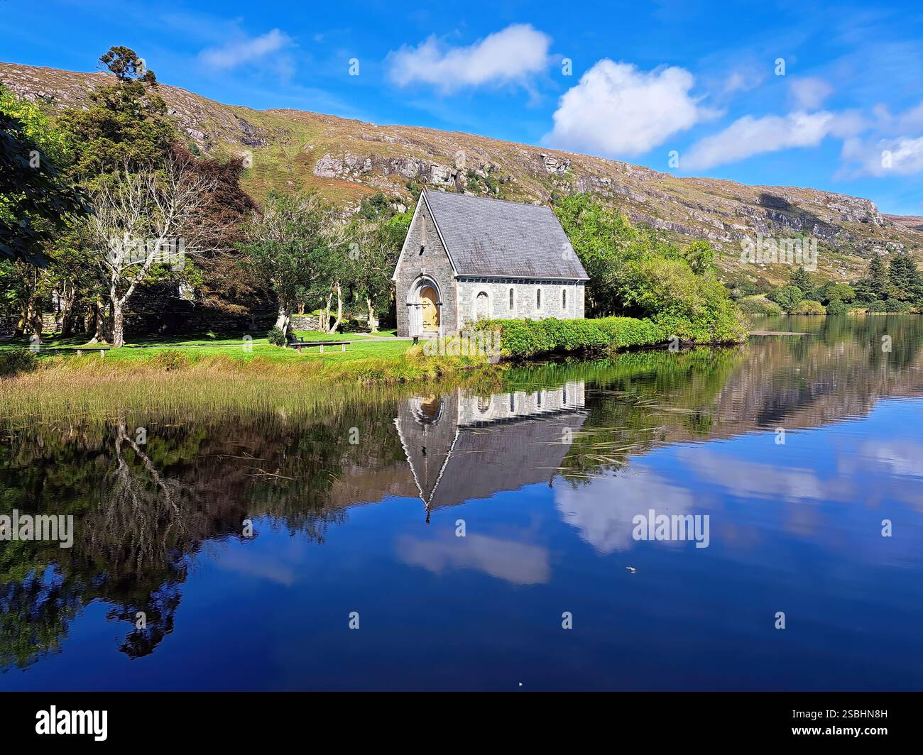 Shrine of St. Finbarr dates back to the 6th century where he communed with God.  The surrounding mountains were his cloister and the lake was for him - Smartphone Captured Stock Image