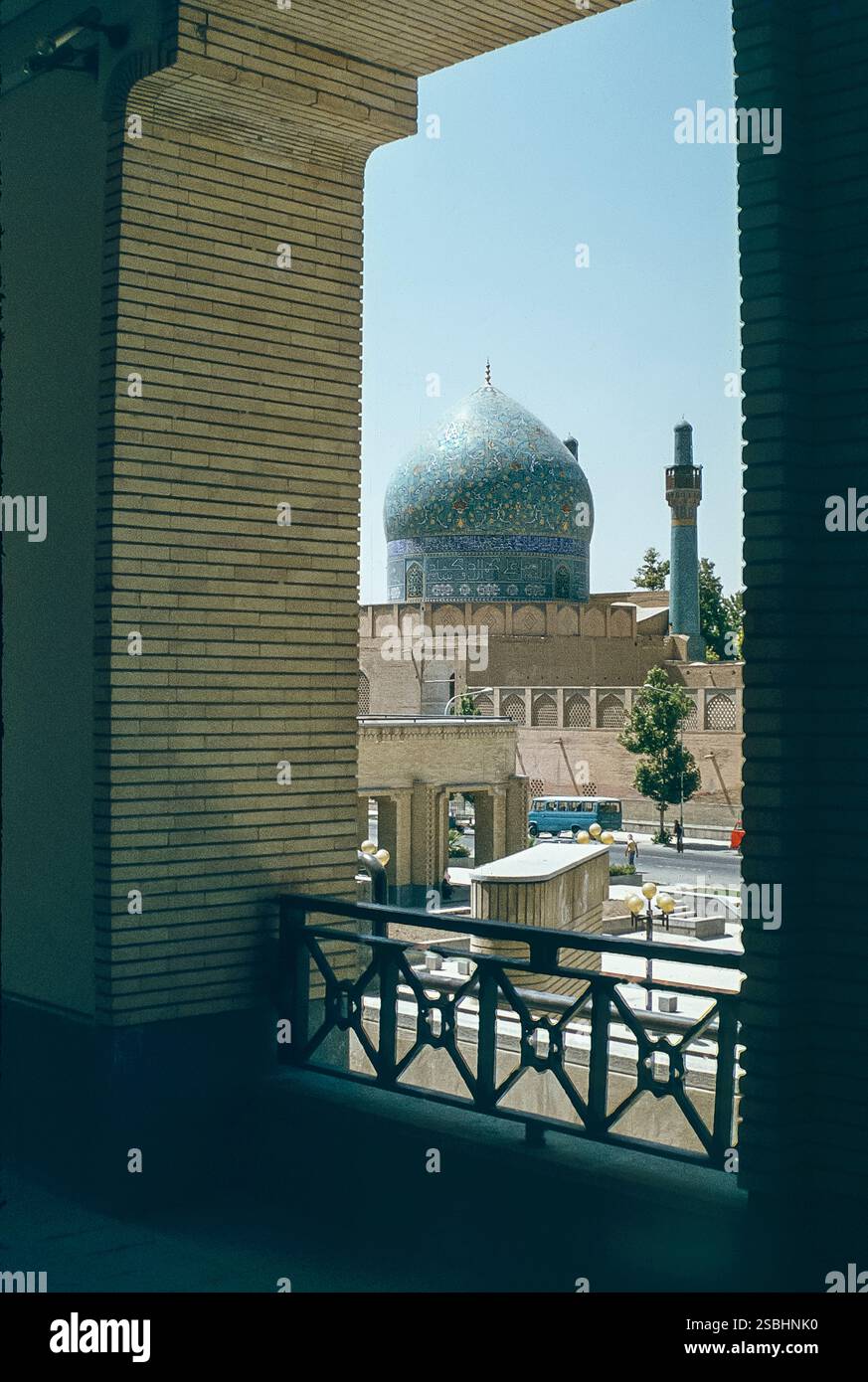 The image is of the Islamic dome and minaret of the Madrese Madar-I ...