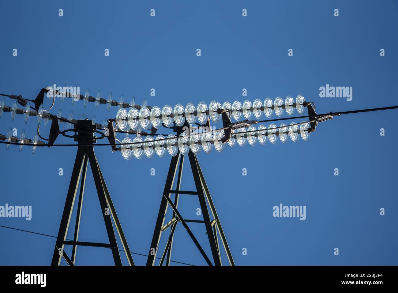 electric pylon in blue sky Stock Photo - Alamy