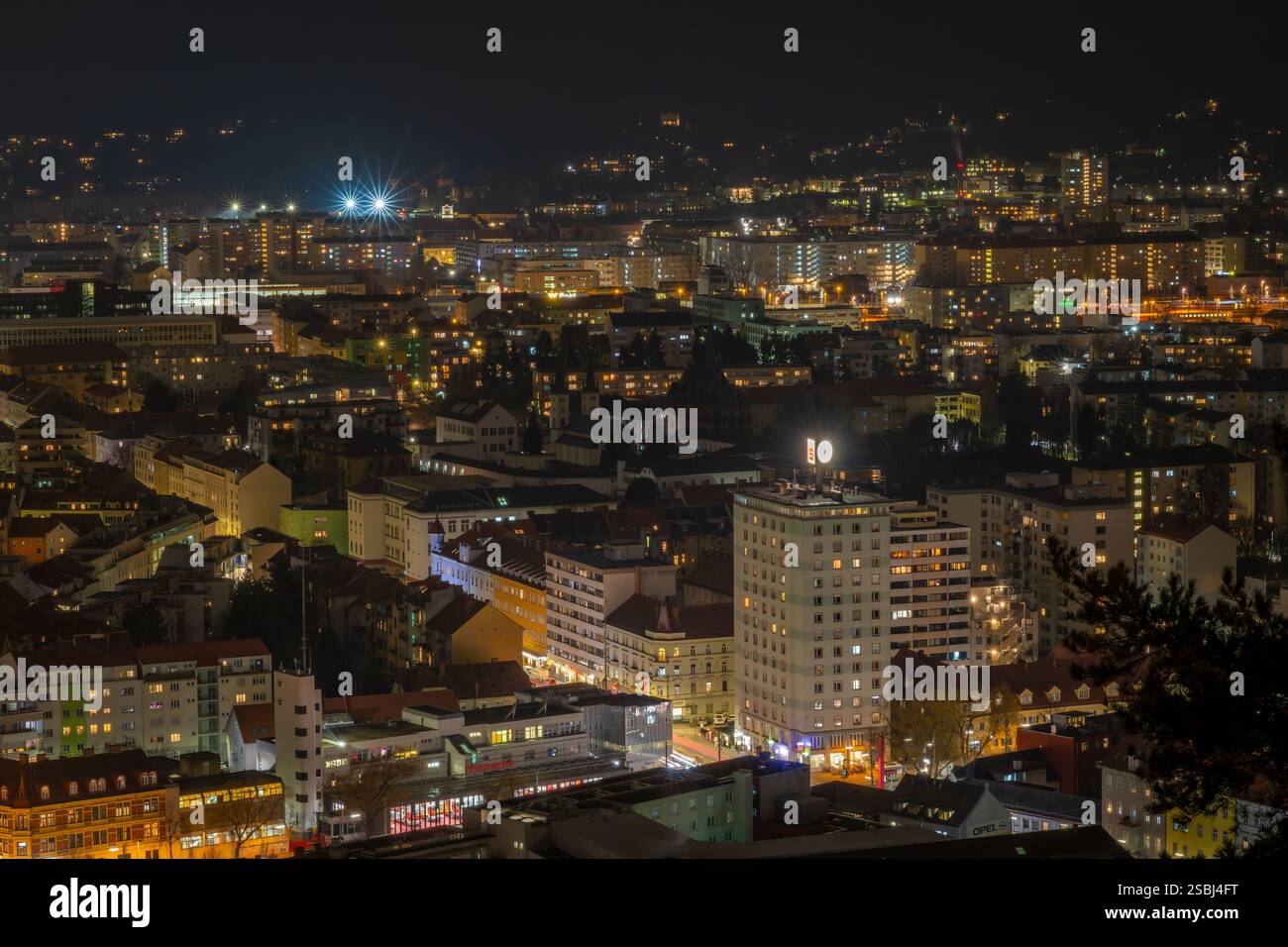 Cloudy night from hill with old tower in winter cold evening in Graz ...