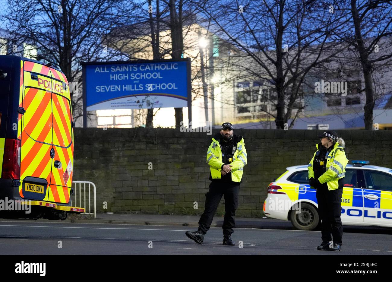 Police officers outside All Saints Catholic High School, on Granville