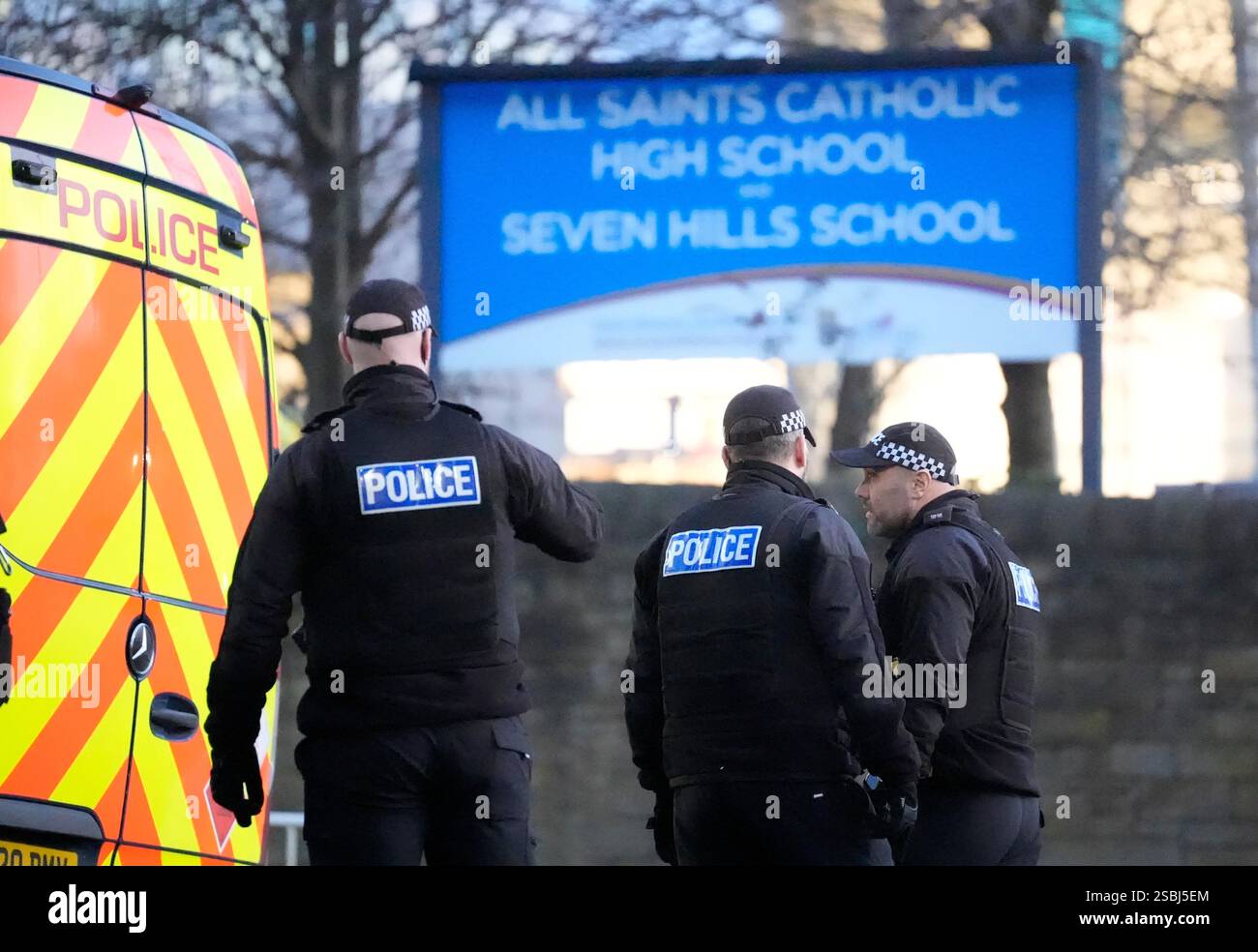Police officers outside All Saints Catholic High School, on Granville