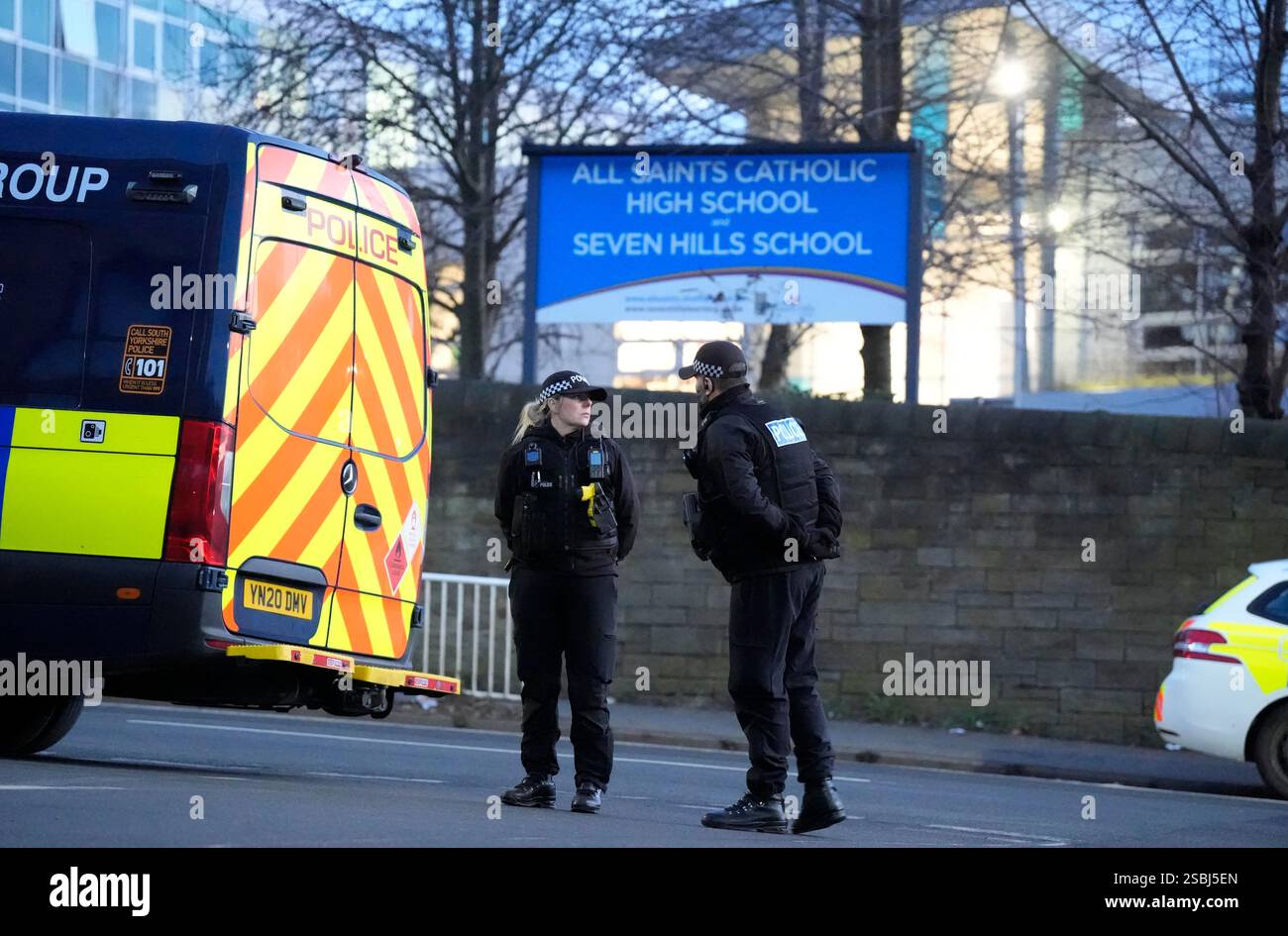 Police officers outside All Saints Catholic High School, on Granville