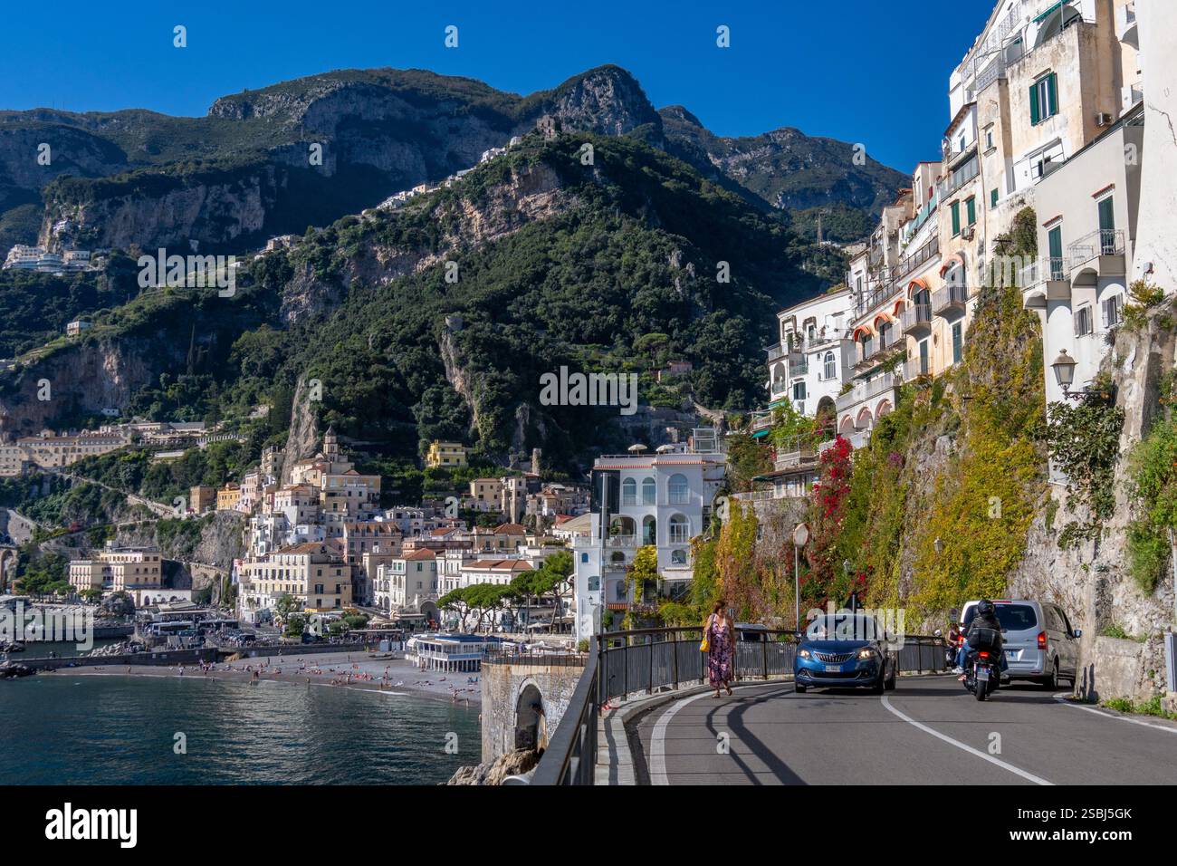 Tourists on the beach at the town of Amalfi on the Amalfi Coast in ...