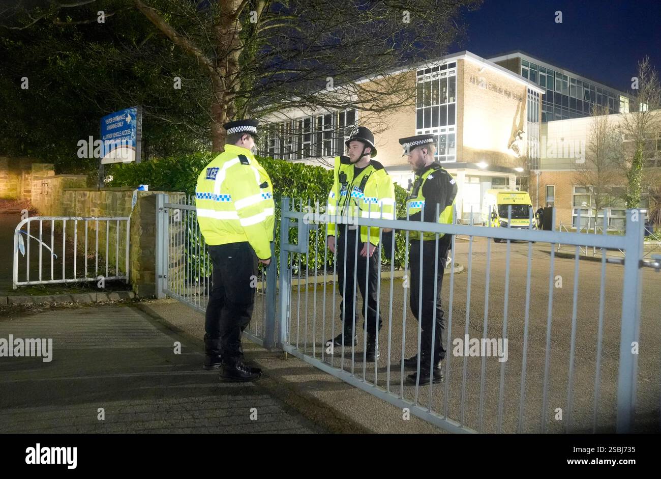 Police officers outside All Saints Catholic High School, on Granville