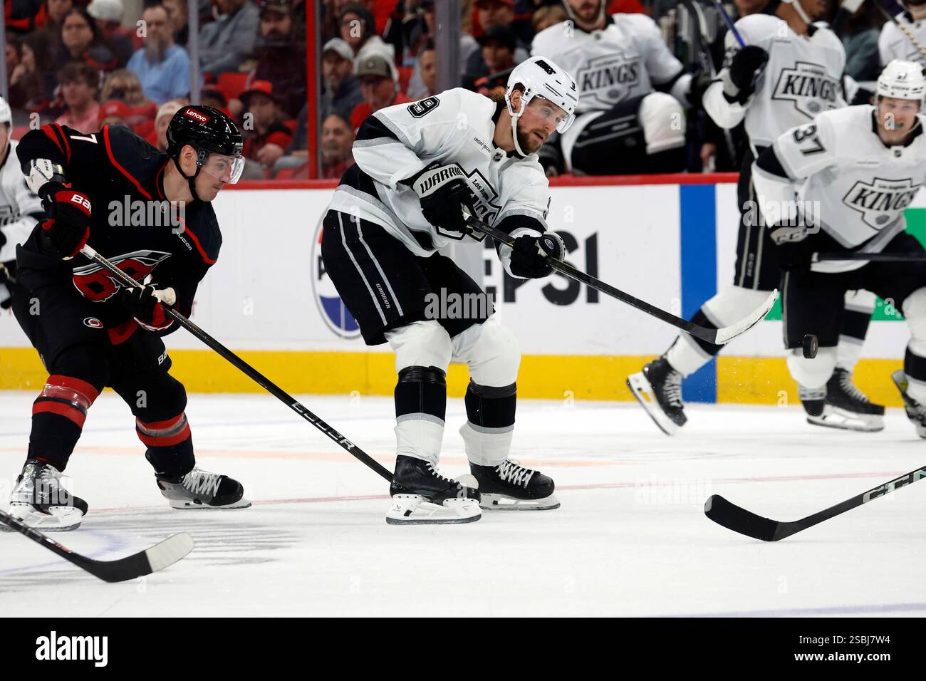 los-angeles-kings-adrian-kempe-9-moves-the-puck-away-from-carolina