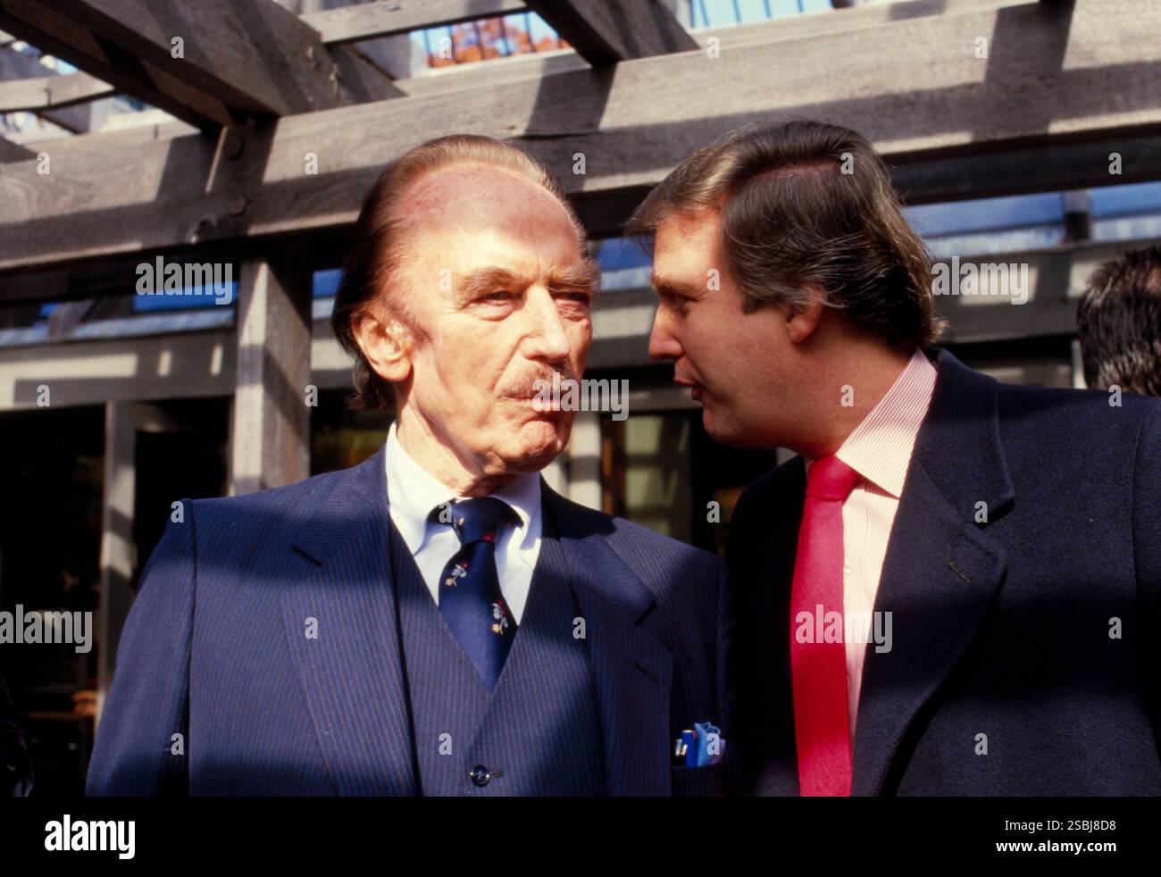 Donald Trump, American politician, media personality, and businessman who served as the 45th president of the United States from 2017 to 2021. Shown here with his father, real estate developer Fred Trump (1905-1999), in New York City in 1980. Photographed by Bernard Gotfryd. Stock Photo