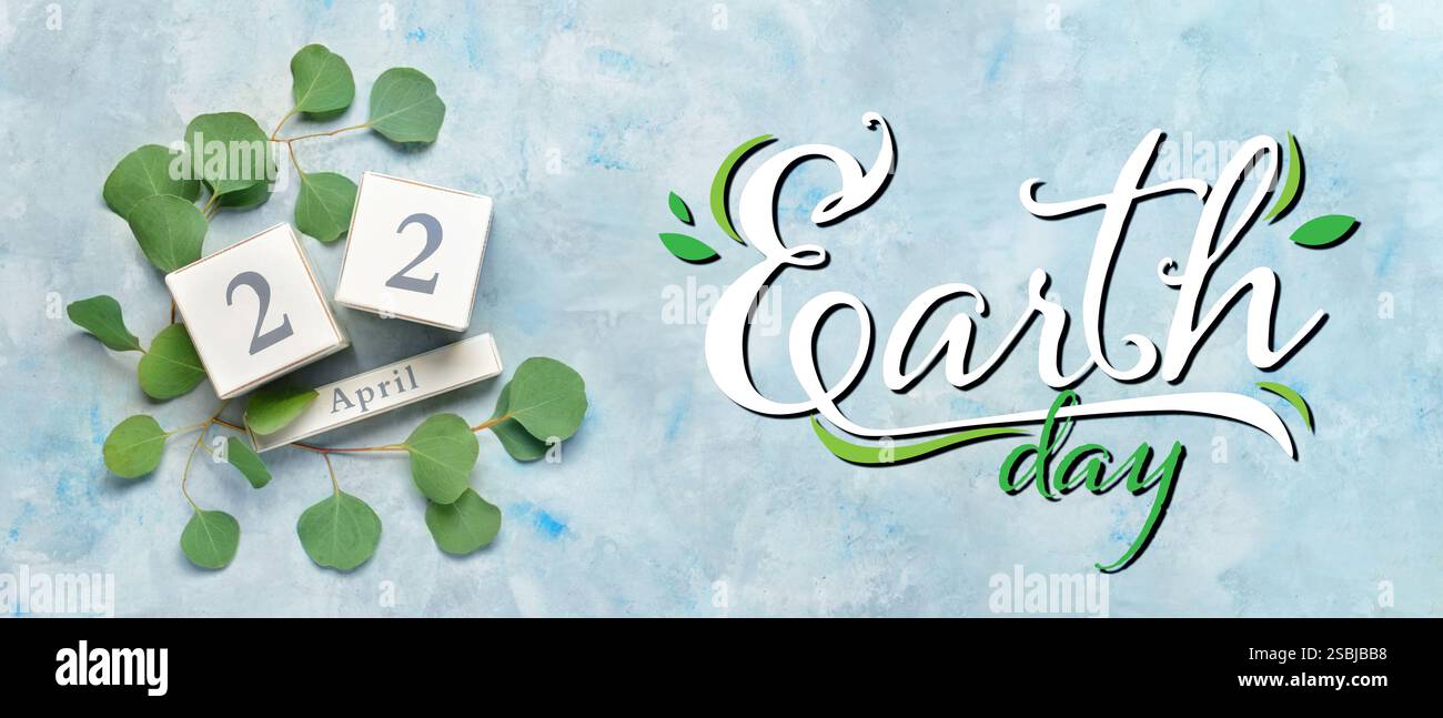 Calendar and plants on light blue background. Banner for Earth Day Stock Photo