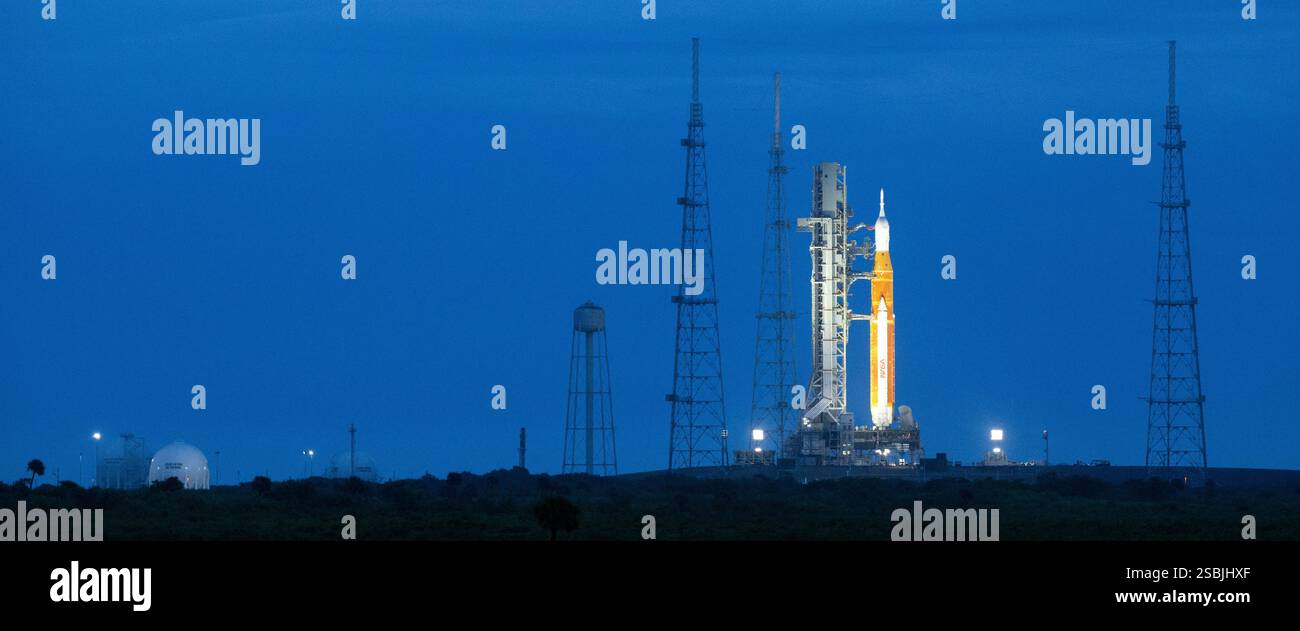 A Space Launch System (SLS) rocket, with the Orion spacecraft aboard, is seen atop a mobile launcher as a team conducts the wet dress rehearsal test for the Artemis I mission to the Moon. Ahead of the Artemis I flight test, the wet dress rehearsal will run through operations to load propellant, conduct a full launch countdown, demonstrate the ability to recycle the countdown clock, and drain the tanks to practice timelines and procedures for launch. Kennedy Space Center, Florida, Saturday, April 2, 2022. Stock Photo
