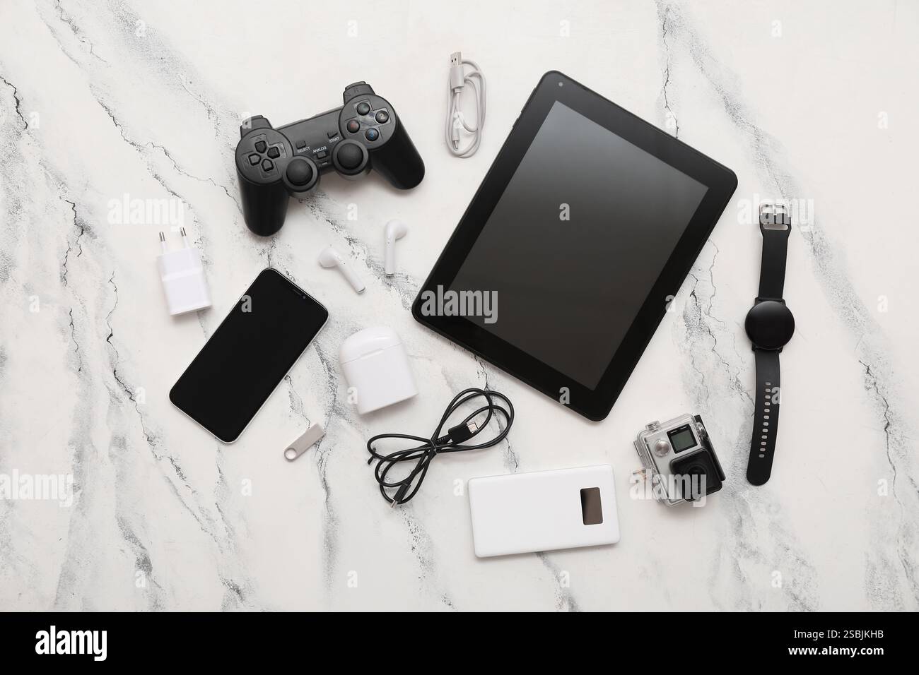 Set of modern gadgets with tablet computer on light background Stock Photo