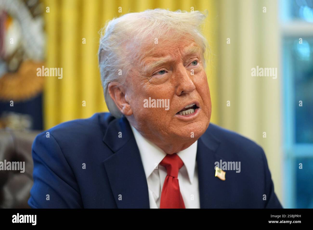 President Donald Trump speaks as he signs executive orders in the Oval