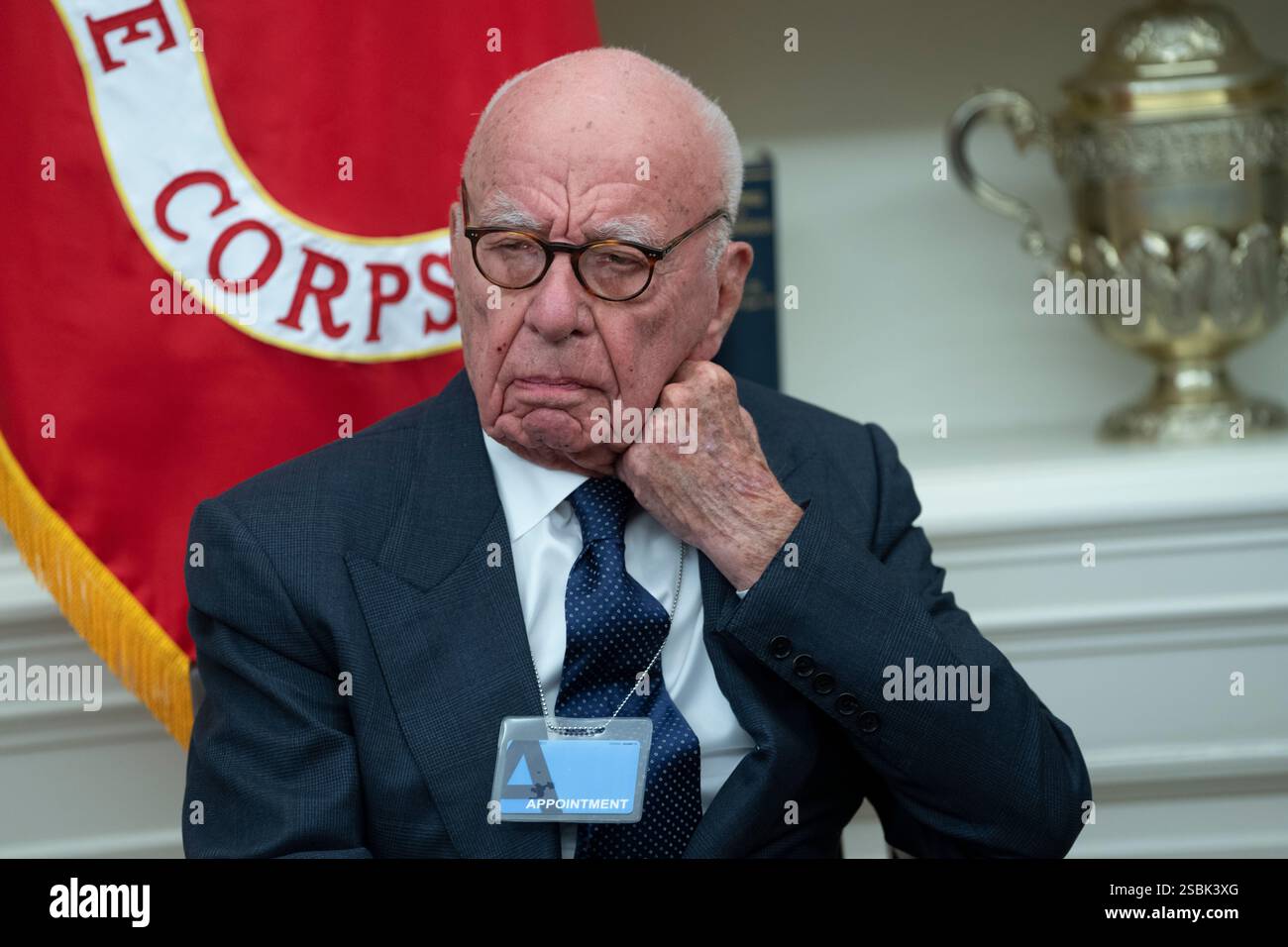 Business magnate Rupert Murdoch watches as United States President