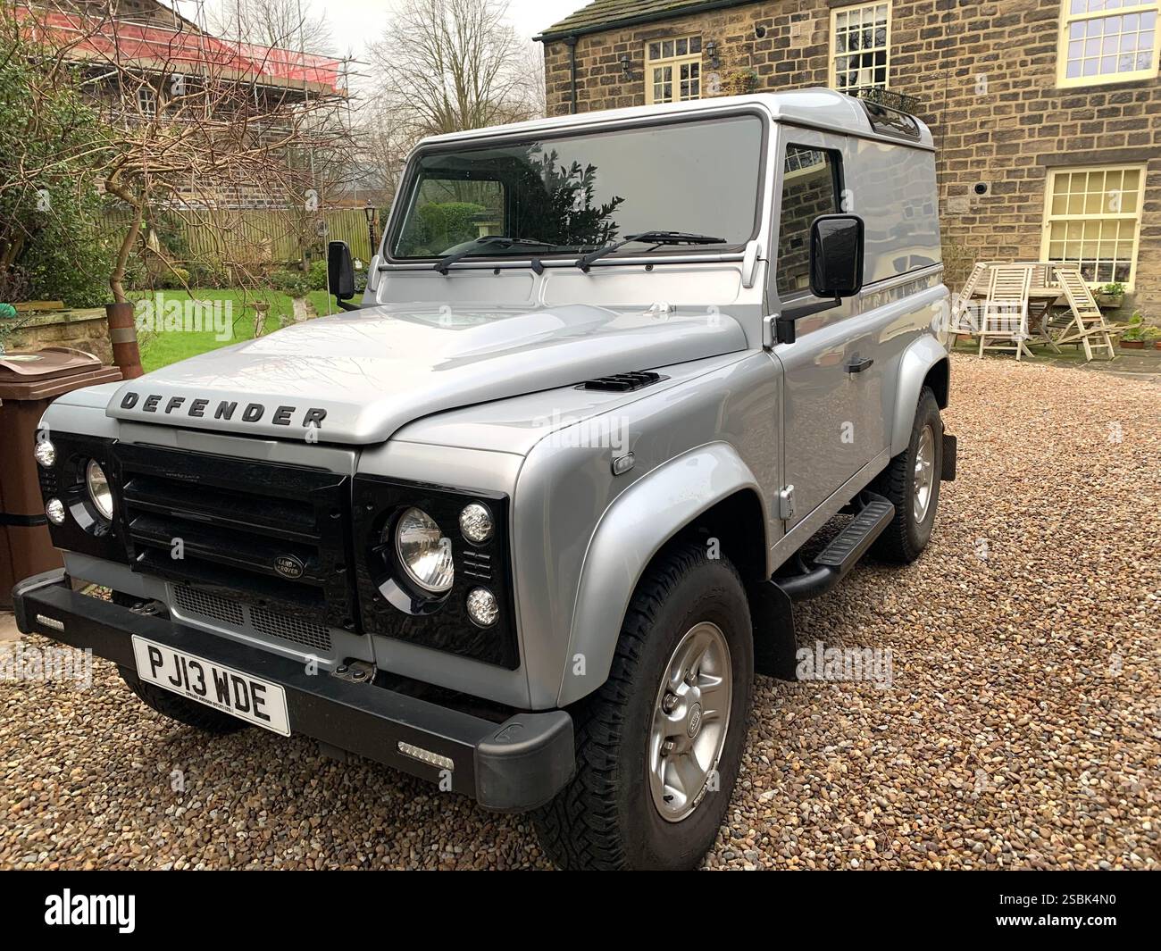 Land rover truck Defender silver farm farmers used outside road path street field type big large metal frame stylish field lane local Guiseley Yorkshire - Smartphone Captured Stock Image
