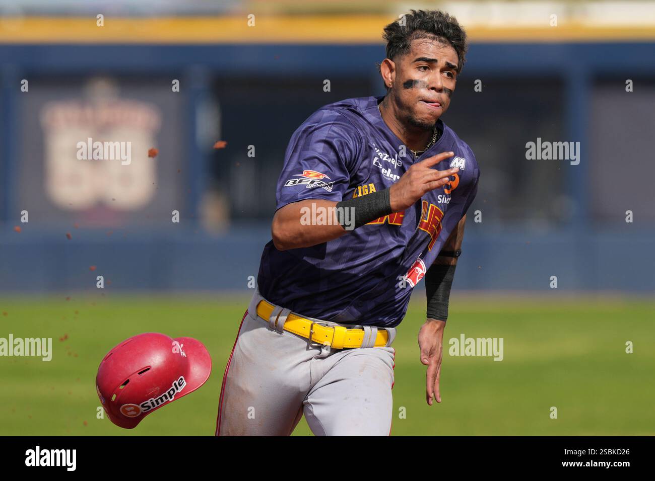 Venezuela's Eduardo Garcia runs home to score a run against Puerto Rico
