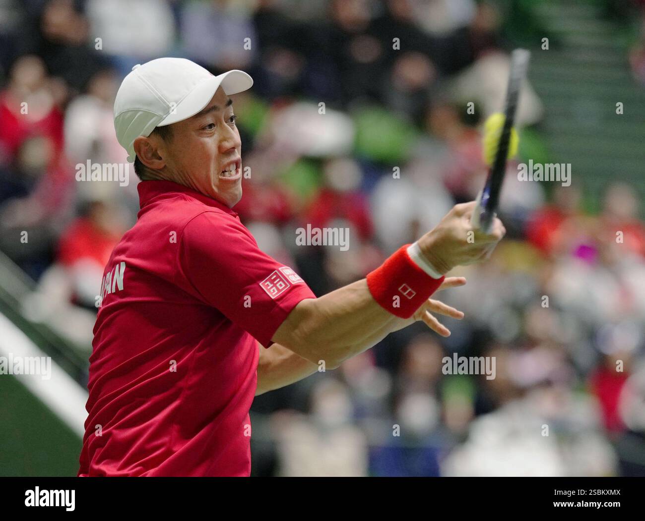 Kei Nishikori of Japan plays against Billy Harris of Britain in a Davis