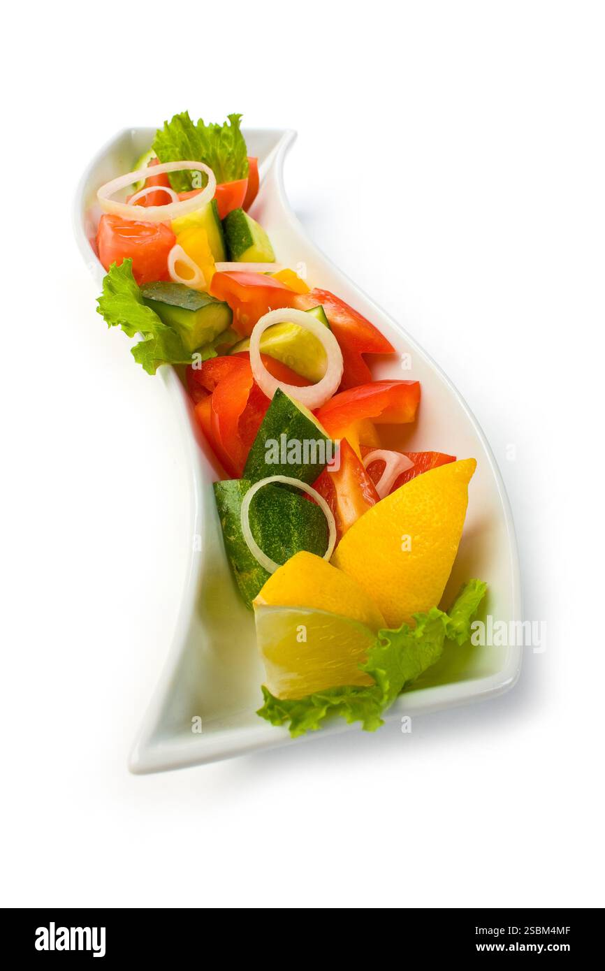 Salad of vegetables isolated on white background Stock Photo - Alamy