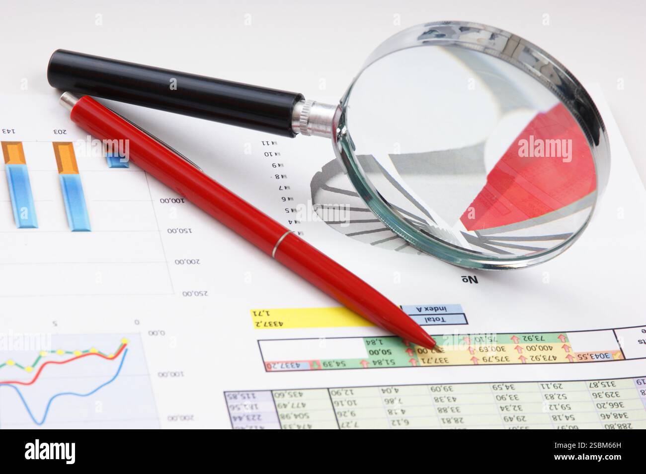 Graphs tables and documents laid on the table Stock Photo